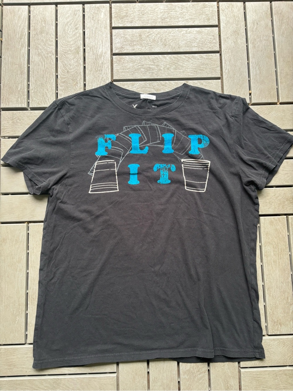 American Eagle Outfitters Black Tee with Blue "FLIP IT" Graphic